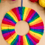 Rainbow tassel wreath made with colourful yarn