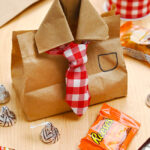 Cute Father's Day gift bag made with a paper sandwich bag and plaid ribbon