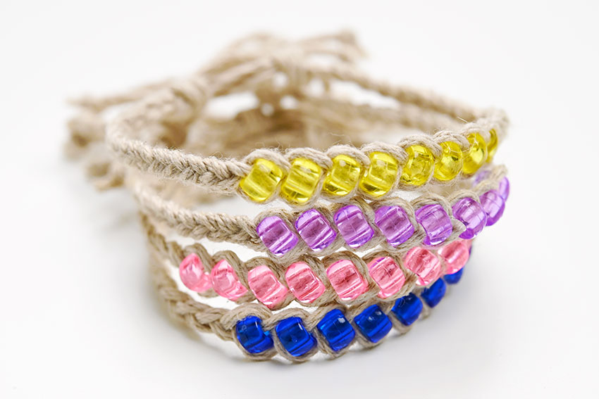 Stack of braided hemp bracelets with beads